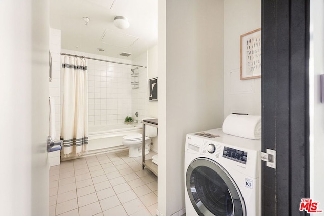 washroom featuring light tile patterned floors and washer / clothes dryer