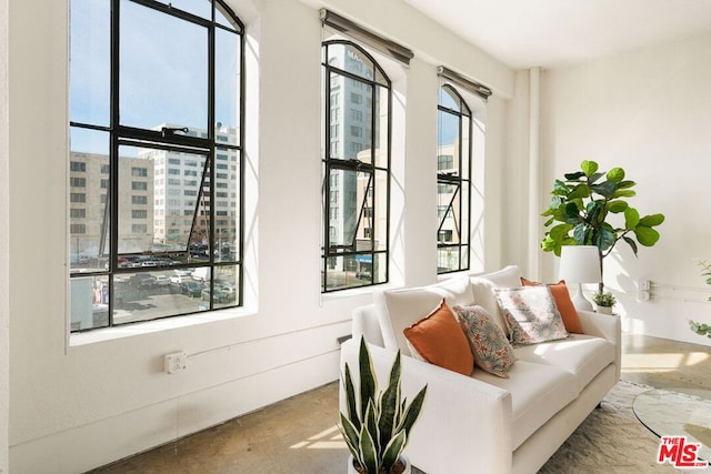 sitting room featuring concrete floors