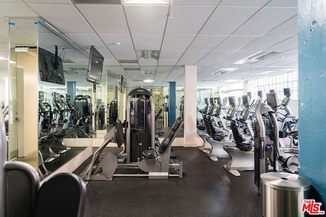 exercise room featuring a paneled ceiling