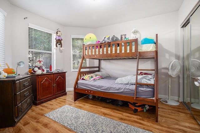 bedroom featuring a closet and light hardwood / wood-style floors