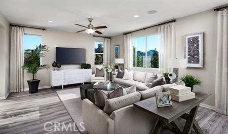 living room featuring hardwood / wood-style floors and ceiling fan