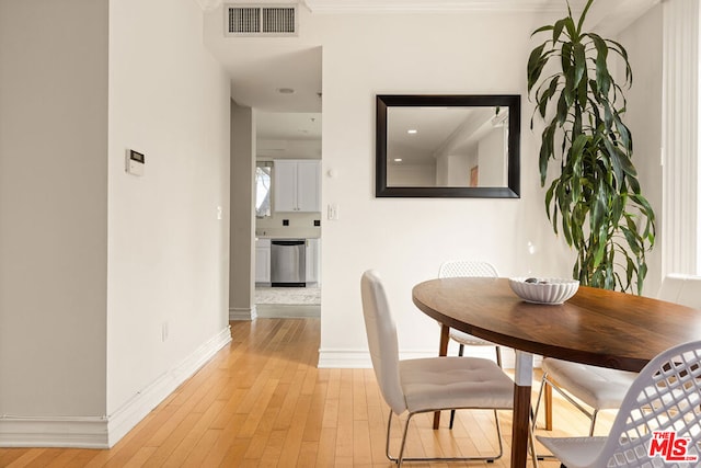 dining room with light wood-type flooring