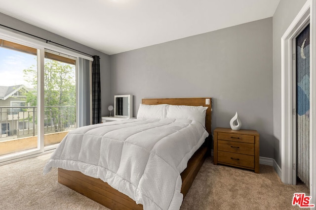 carpeted bedroom featuring access to exterior