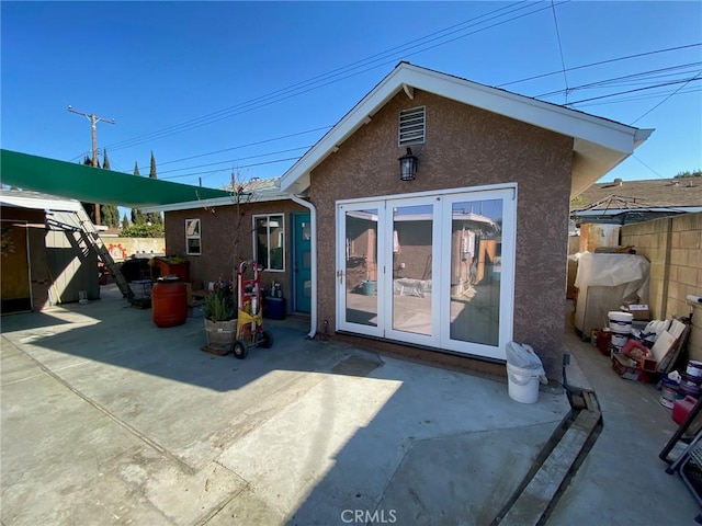 rear view of property with a patio and french doors