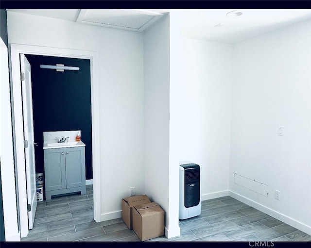 interior space with light hardwood / wood-style flooring and sink