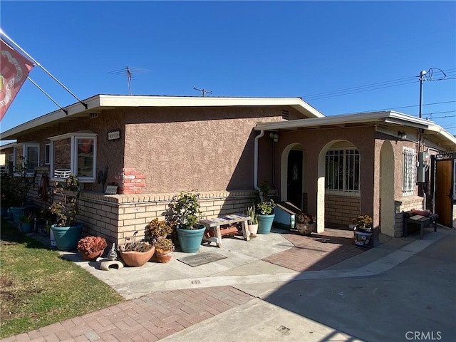 back of property featuring a patio