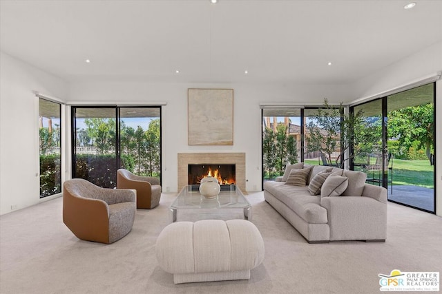 carpeted living room featuring a fireplace