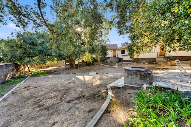 view of yard featuring a patio area and fence