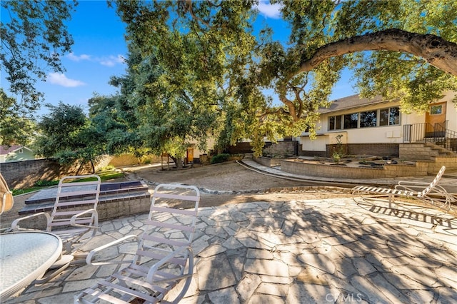 view of patio / terrace featuring fence