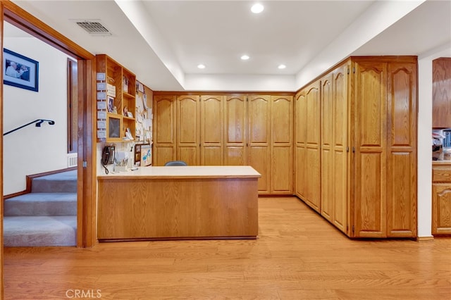 kitchen featuring light wood-style flooring, recessed lighting, a peninsula, visible vents, and light countertops