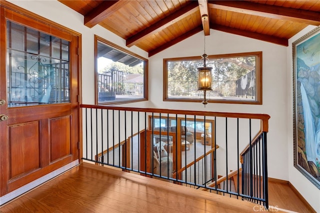 interior space with wooden ceiling and lofted ceiling with beams