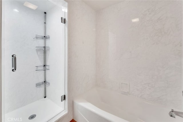 bathroom with a shower stall and a bath