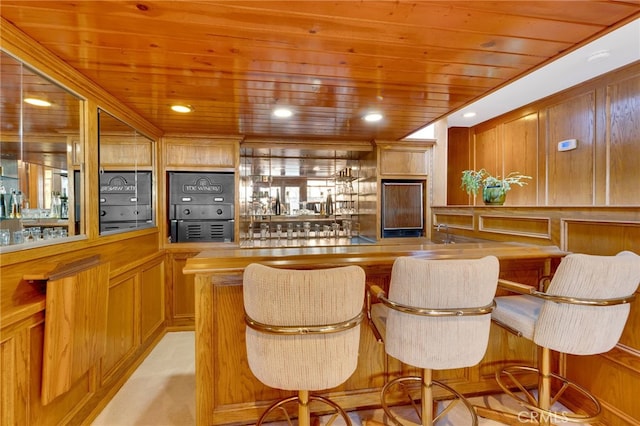 bar featuring a dry bar, wood ceiling, and recessed lighting