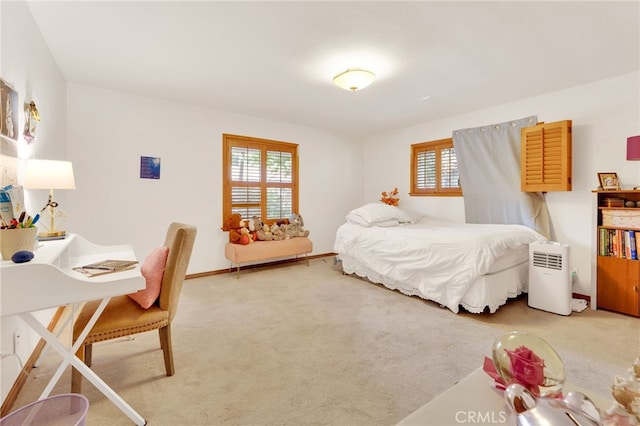 carpeted bedroom with baseboards