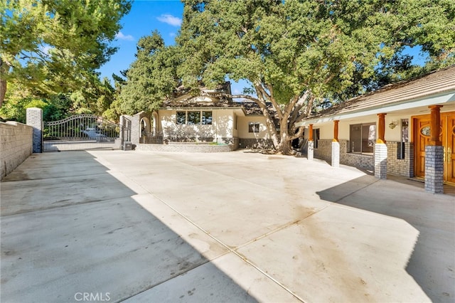 view of front of house with fence and a gate