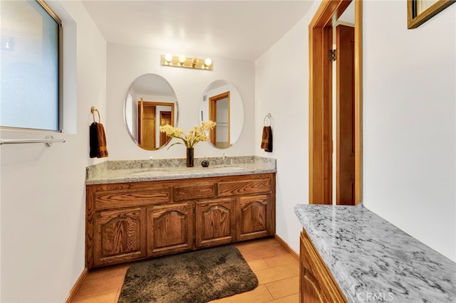 bathroom with hardwood / wood-style flooring and vanity