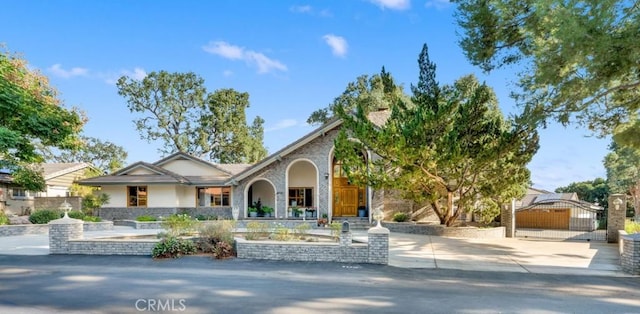 view of front of property with a gate and fence