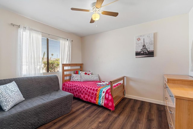 bedroom with ceiling fan and dark hardwood / wood-style flooring