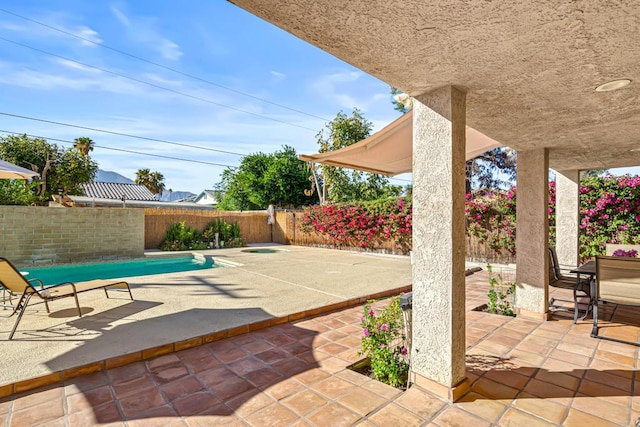 view of patio / terrace featuring a fenced in pool