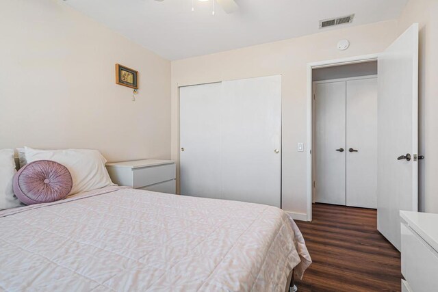 bedroom featuring ceiling fan and dark hardwood / wood-style floors