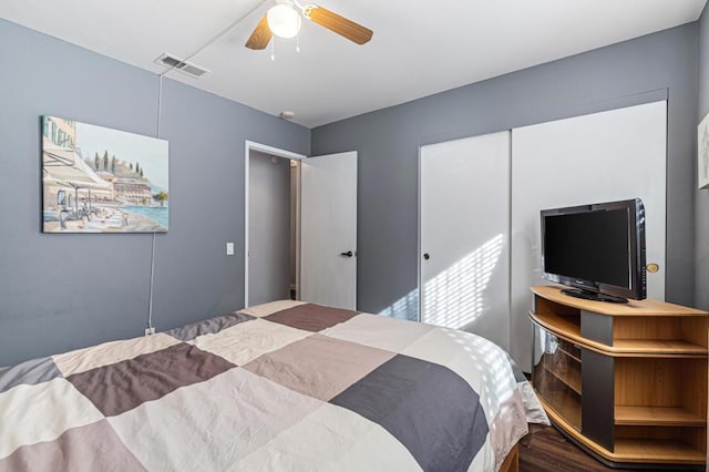 bedroom featuring hardwood / wood-style flooring and ceiling fan