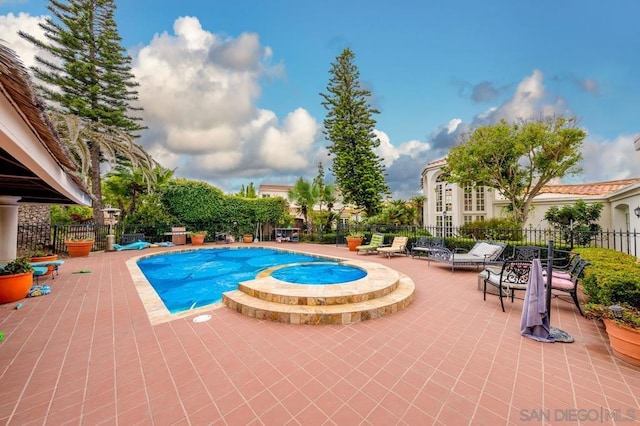 view of pool featuring a patio area