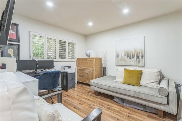 office area with light hardwood / wood-style floors