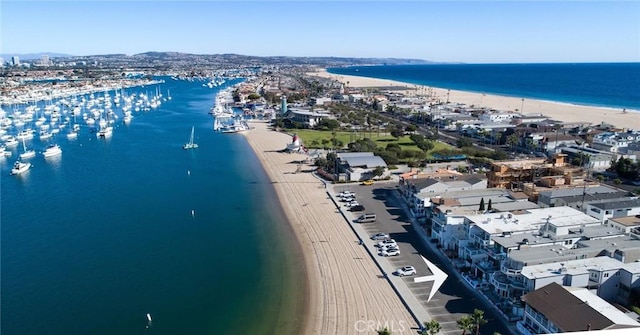 bird's eye view featuring a beach view and a water view