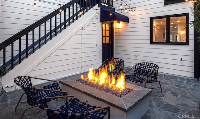 view of patio / terrace with a fire pit