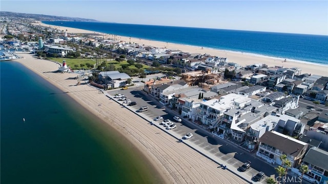 aerial view featuring a view of the beach and a water view