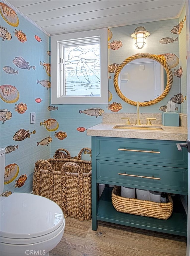 bathroom with toilet, vanity, wood ceiling, and hardwood / wood-style flooring