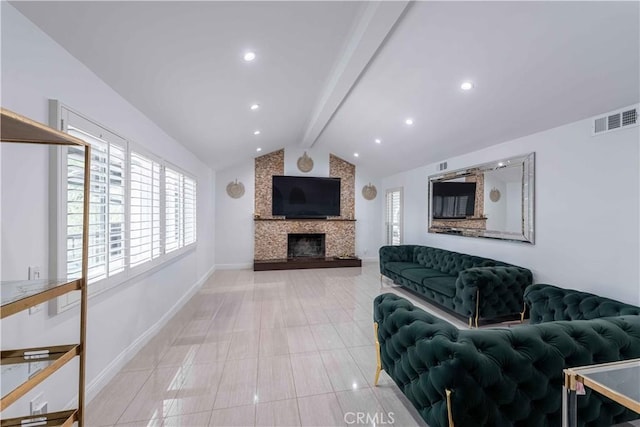 living room featuring lofted ceiling with beams, a stone fireplace, and light tile patterned floors