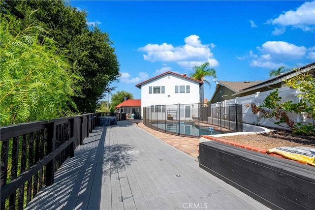 exterior space with a patio area and a wooden deck