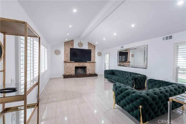 tiled living room with a fireplace and lofted ceiling with beams