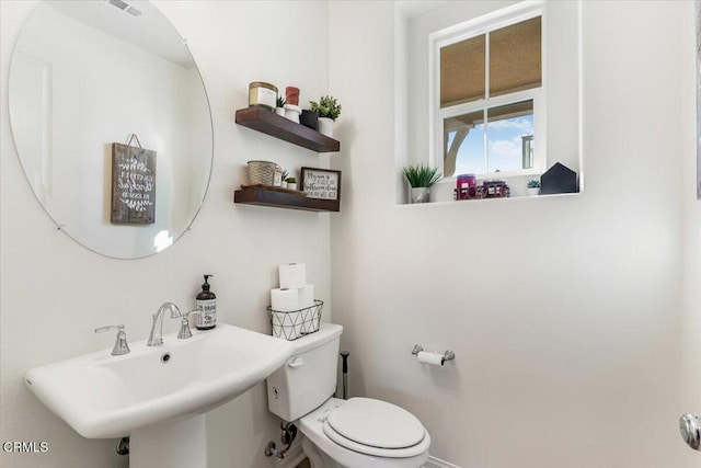 bathroom featuring sink and toilet