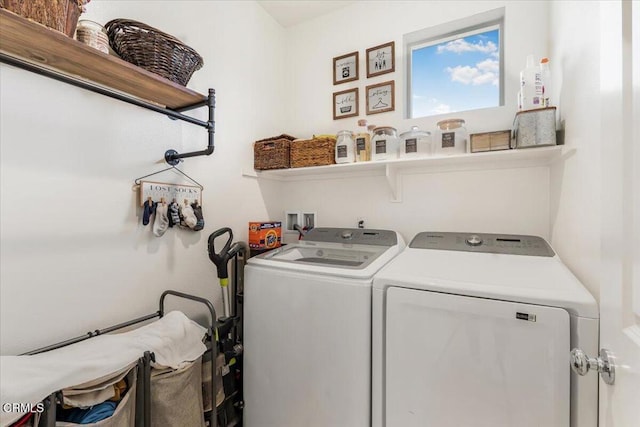 washroom with washing machine and clothes dryer