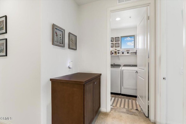 laundry room with washing machine and dryer