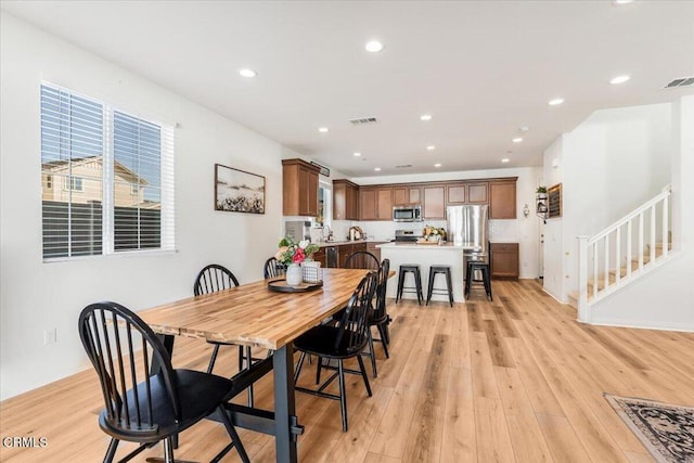 dining room featuring light wood-type flooring