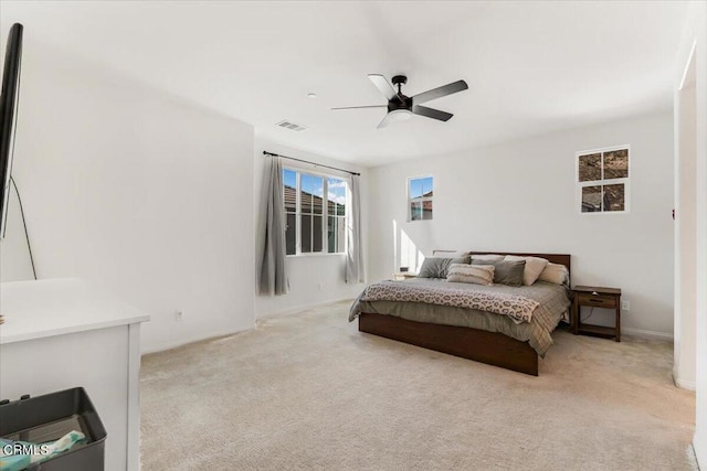 bedroom featuring ceiling fan and light colored carpet