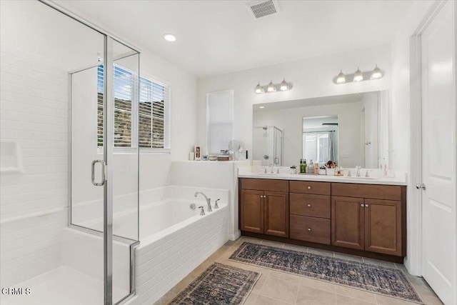 bathroom with separate shower and tub, tile patterned floors, and vanity