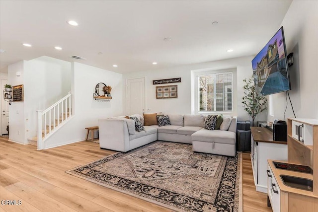 living room with light hardwood / wood-style flooring