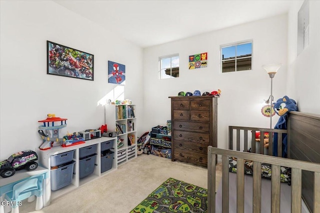 bedroom with carpet flooring and a crib