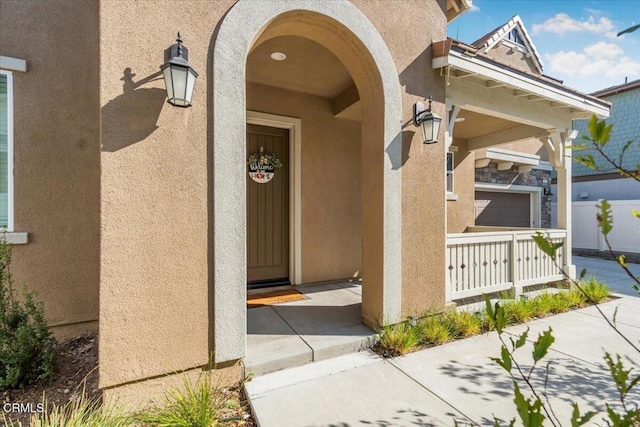 doorway to property with a porch