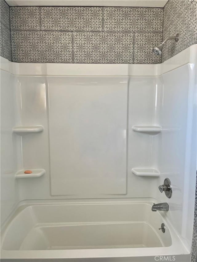 bathroom with shower / tub combination