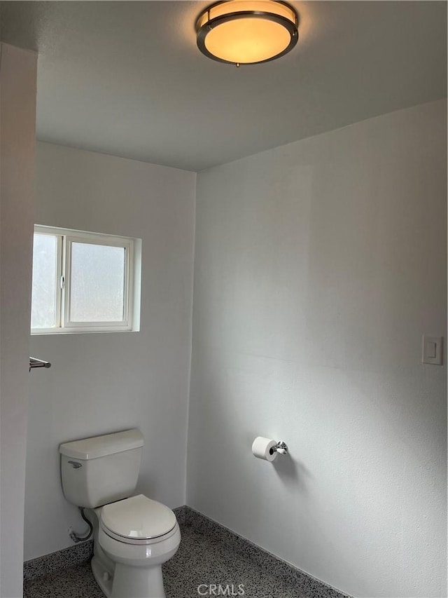 bathroom featuring toilet