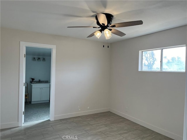 unfurnished room with ceiling fan