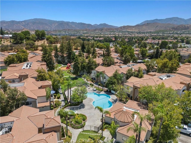 birds eye view of property with a mountain view