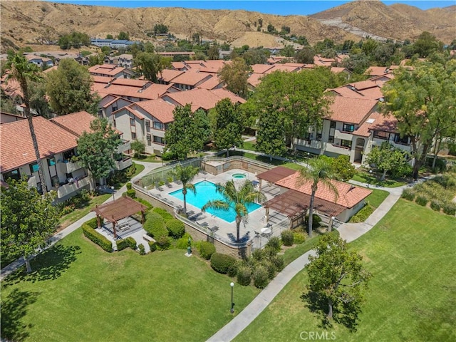 birds eye view of property with a mountain view