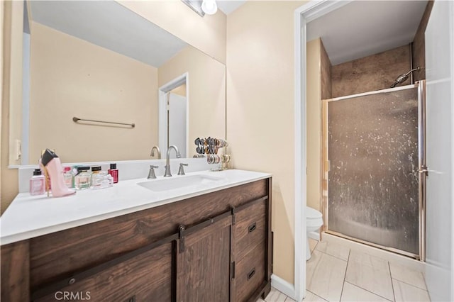 bathroom with an enclosed shower, vanity, toilet, and tile patterned floors