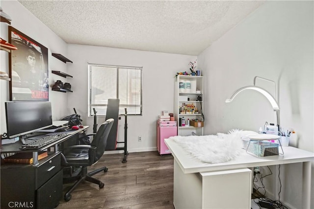 home office featuring dark hardwood / wood-style flooring and a textured ceiling